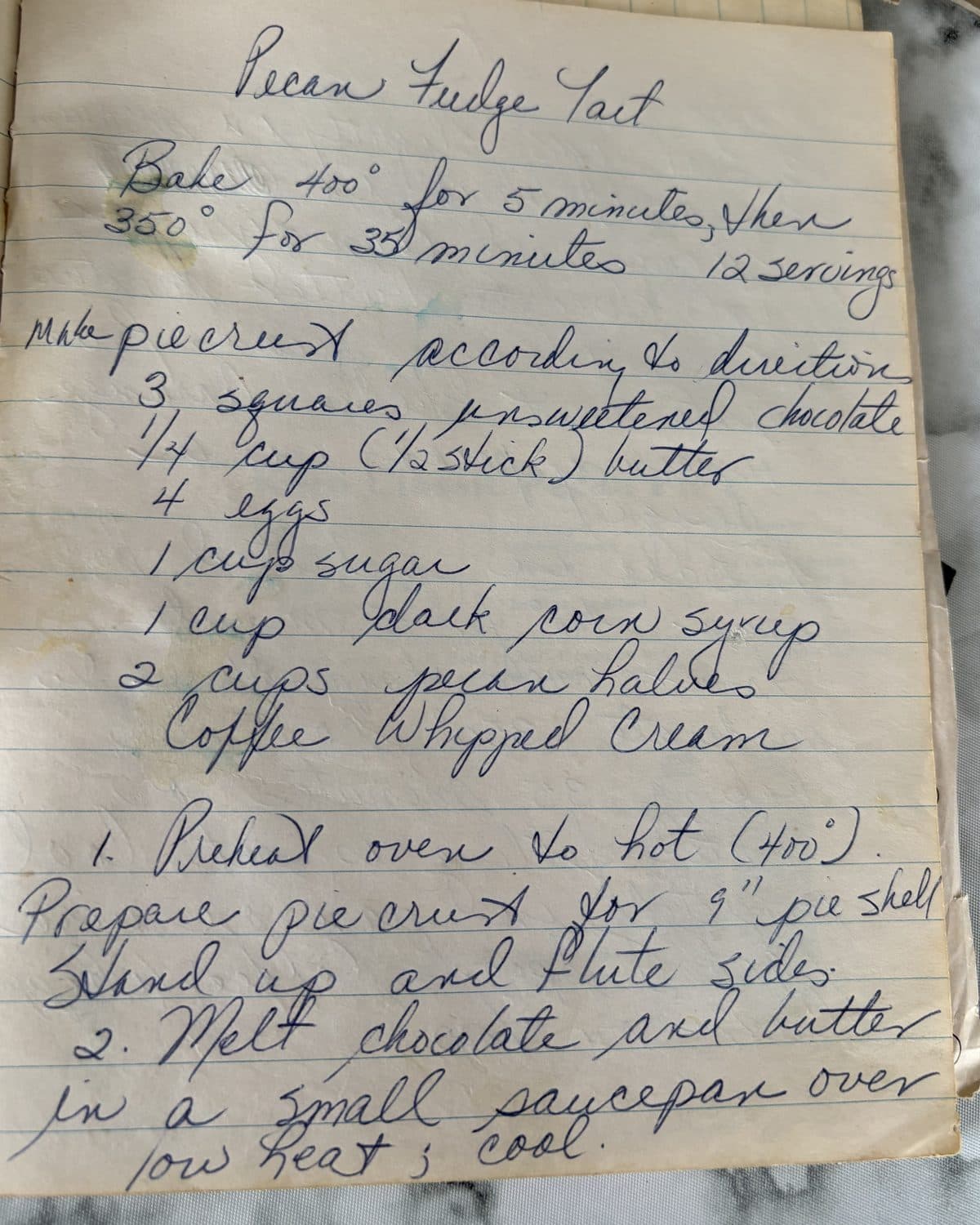Mom's handwritten recipe for Pecan Fudge Tart, on a lined notebook page